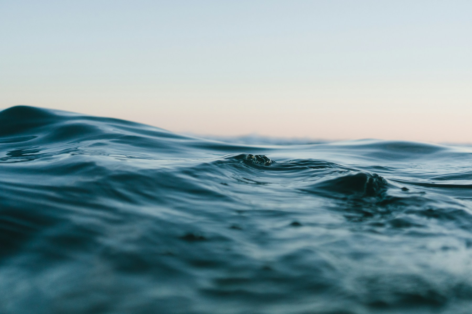 Sunlight across blue ocean water