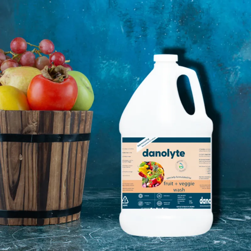 Original Danolyte Fruit and Veggie Wash product beside fresh fruit